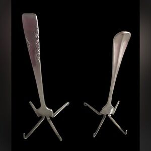Two vintage silver plated fork card holders.